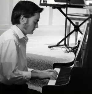 Student playing piano at a DenLee Music School recital
